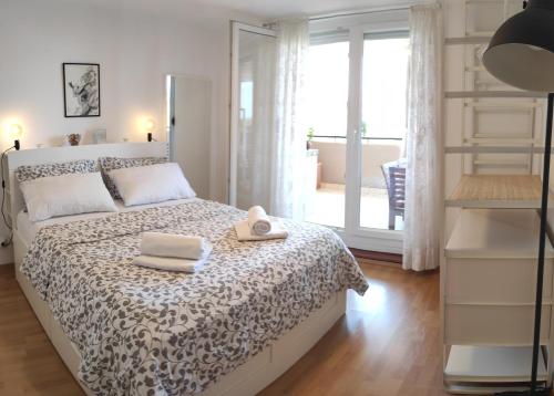 a bedroom with a bed with two towels on it at Apartment Leone Umag in Umag