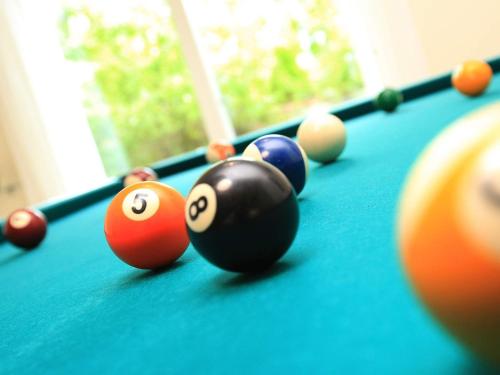 a group of pool balls on a pool table at 12 person holiday home in Haderslev in Årøsund