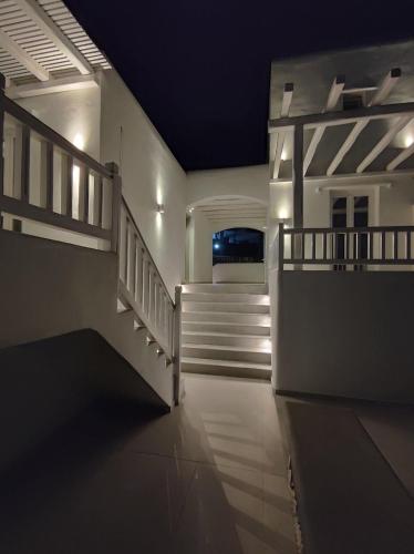 a hallway of a house with stairs and lights at Sofos Suites Mykonos in Mýkonos City