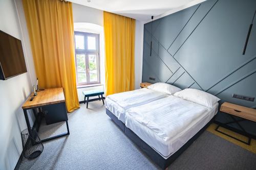 Postel nebo postele na pokoji v ubytování Hotel Gabriella