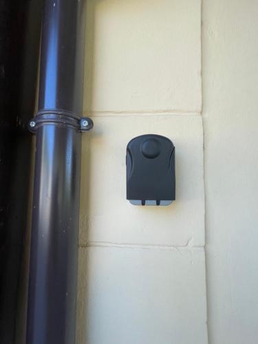 a black outlet on a wall with a pole at Il Ritrovo de La Pre in Predappio