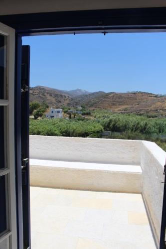 an open door to a balcony with a view at Beach Villa Akrotiri in Engares