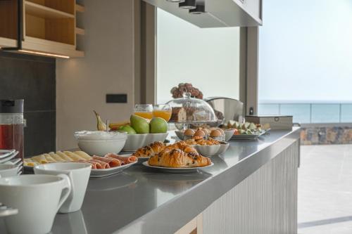 a buffet of food on a counter in a kitchen at panorama new generation in Sfakia