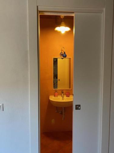 a bathroom with a sink and a mirror at B&B Etico La Casa di Toti in Modica