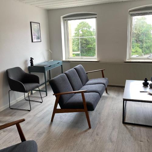 Ein Sitzbereich in der Unterkunft Hotel Røde-Kro