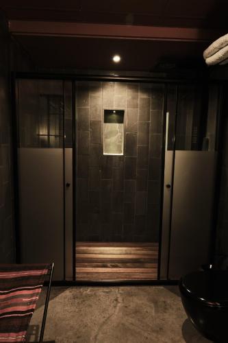 a glass door in a room with at Carus Cappadocia in Goreme