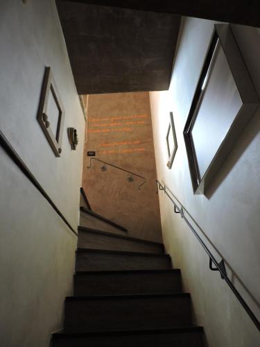 a staircase in a building with a window at Albachiara home - vista mare in Cipressa