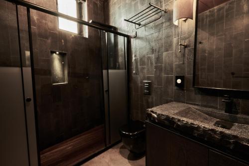 a bathroom with a shower and a toilet and a sink at Carus Cappadocia in Goreme