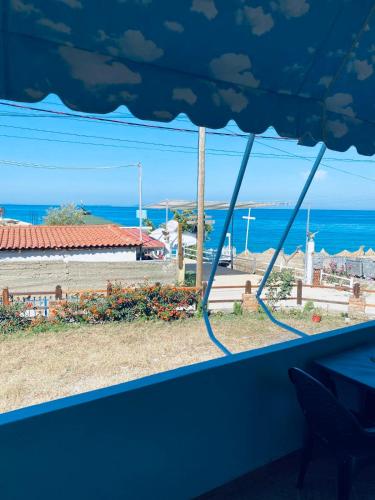 a view of the ocean from a window at Villa Praljan in Borsh