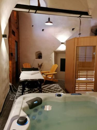 a jacuzzi tub in the middle of a living room at Les Terres Rouges 06 in Guillaumes