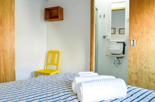 a bedroom with a bed with towels on it at Hidden Gem w/ Rooftop - City Center & Douro View in Peso da Régua