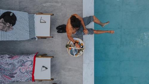 a man is doing a trick on a skateboard at Liberte Maisonettes in Parga