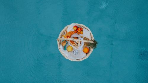an overhead view of a small boat in the water at Liberte Maisonettes in Parga
