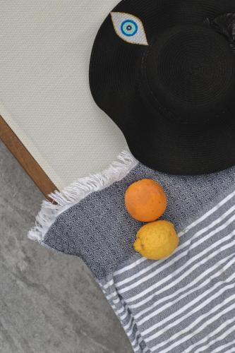 two oranges sitting on top of a table at Liberte Maisonettes in Parga