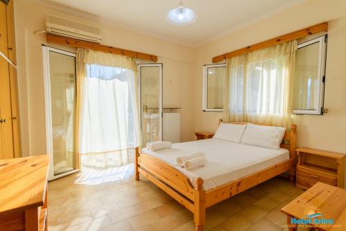 Posteľ alebo postele v izbe v ubytovaní Hotel Arion