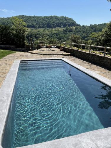 a pool of water with a view of the countryside at Santa Llúcia Rupit in Rupit