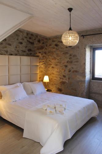Voodi või voodid majutusasutuse Casas Tomé - Turismo Rural - Country Houses toas