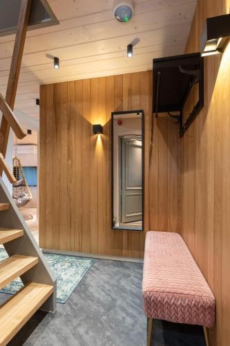 a small room with a bench and a mirror at Põlva Maja apartments - contactless check-in in Põlva