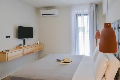 Ένα ή περισσότερα κρεβάτια σε δωμάτιο στο Princess Mare Hotel - Adults Only
