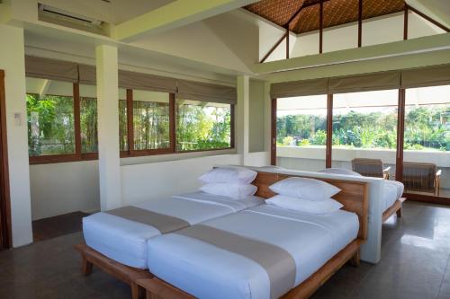 Tegal Sari Accommodation Ubudにあるベッド