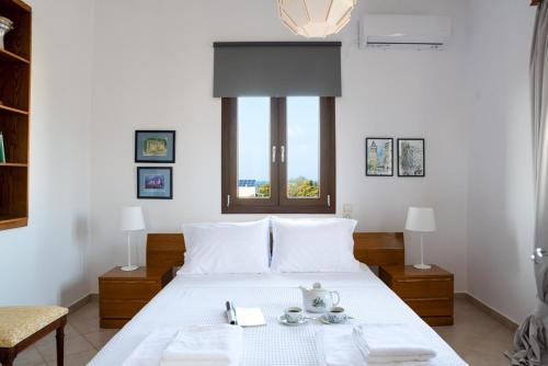 Säng eller sängar i ett rum på Villa Thalia