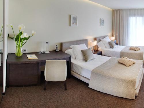 Letto o letti in una camera di Cosmopolita Hotel Boutique & Spa