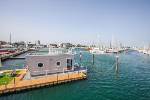 a boat is docked at a marina with boats at House Boat Rimini Resort in Rimini