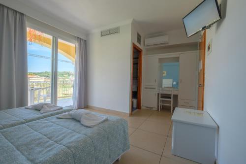Katil atau katil-katil dalam bilik di Hotel Athina