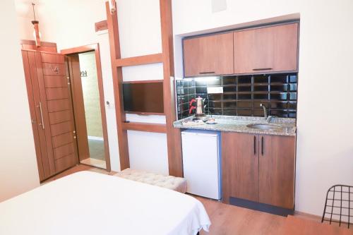 a small kitchen with a sink and a counter at BetaS GuestHouse in Antalya