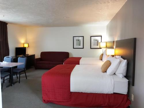 Postel nebo postele na pokoji v ubytování Seely's Motel