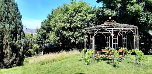 a gazebo in the middle of a garden at Ruhestifter-Salem mit Aromasauna und Hot Tub in Salem