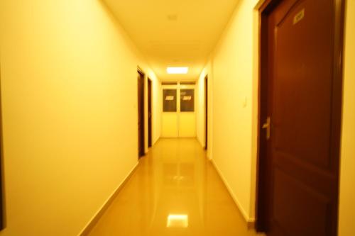 a hallway of a hospital with a long corridor at North Centre in Cochin