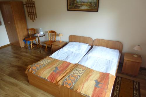 Voodi või voodid majutusasutuse Leśny Dworek toas