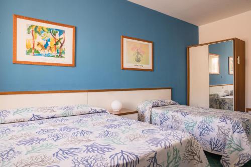 Postel nebo postele na pokoji v ubytování Hotel Clelia