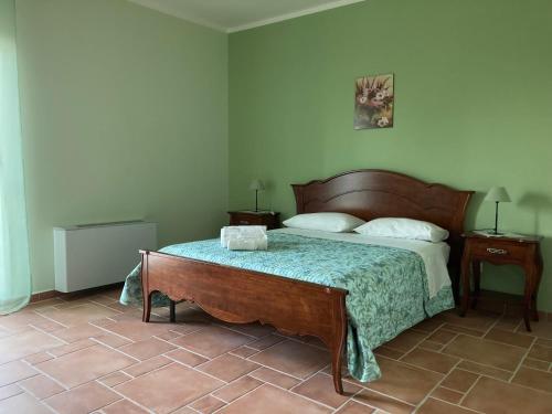 A bed or beds in a room at Agriturismo Tenuta della Madama