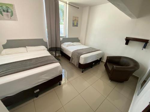 Voodi või voodid majutusasutuse Micro Hotel Rio de Piedras toas