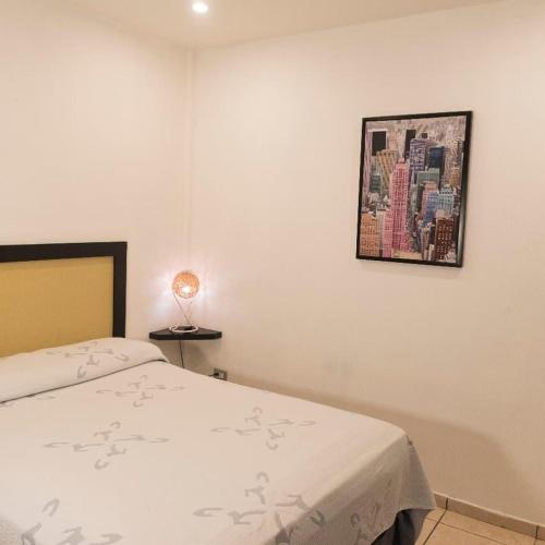 Ένα ή περισσότερα κρεβάτια σε δωμάτιο στο Micro Hotel Rio de Piedras
