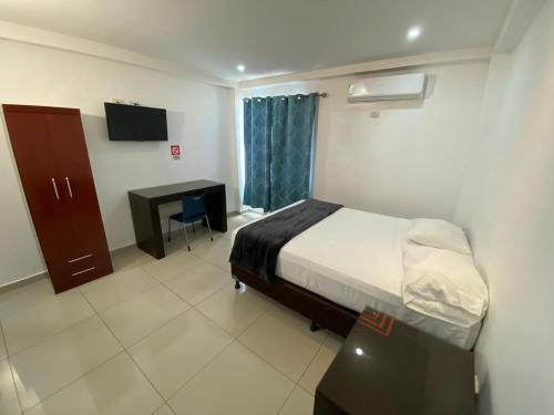 Ένα ή περισσότερα κρεβάτια σε δωμάτιο στο Micro Hotel Rio de Piedras