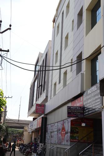 a building with signs on the side of it at HOTEL SRI VAARI RESIDENCY in Hosūr