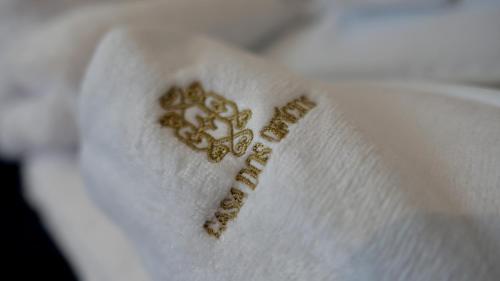 a close up of a piece of paper with a writing on it at Casa dos Ofícios Hotel in Tomar
