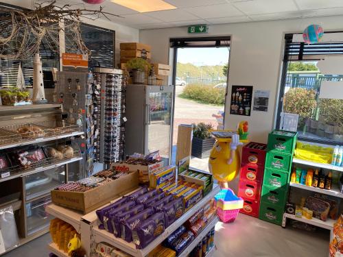 a store filled with lots of products in a store at Chalet Ibiza in de duinen van IJmuiden aan Zee in IJmuiden