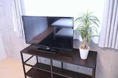 TV a/nebo společenská místnost v ubytování Laffitte Tokyo