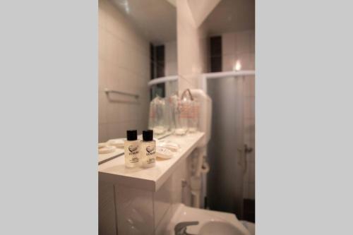 a bathroom with a shower and a sink and a toilet at Apartment Đozić in Srebrenica