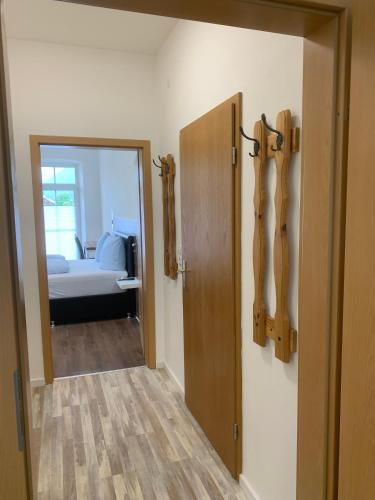 a room with a door leading to a bedroom at Gasthof Löwen in Pfronten
