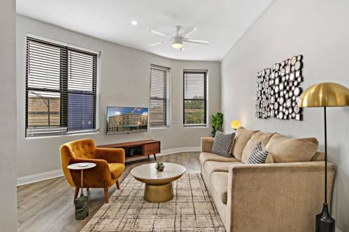 a living room with a couch and a chair at 3BR Apt in Logan Square Walkable to Highlights - Central Park S6 in Chicago