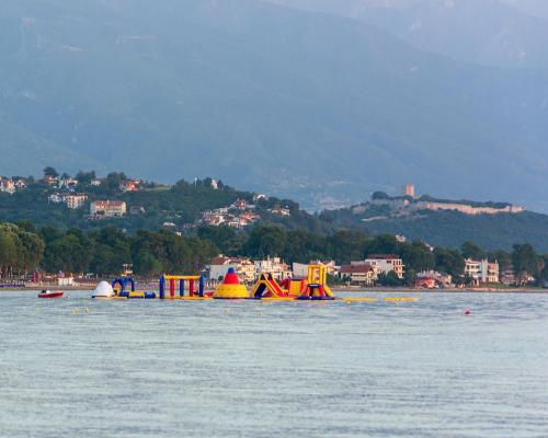 a group of colorful boats in a body of water at Vila Aleka in Nei Poroi