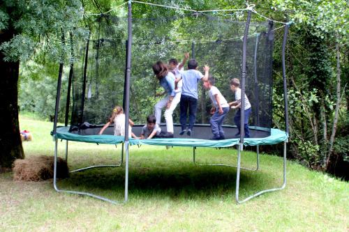 a group of people playing on a trampoline at Moinhos Carvalhas in Arcos de Valdevez
