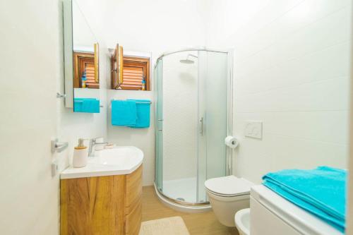 a bathroom with a shower and a sink and a toilet at Apartment Vabriga in Vabriga