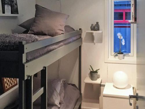 a bedroom with a bunk bed in a room at Holiday home SÄRNA in Särna