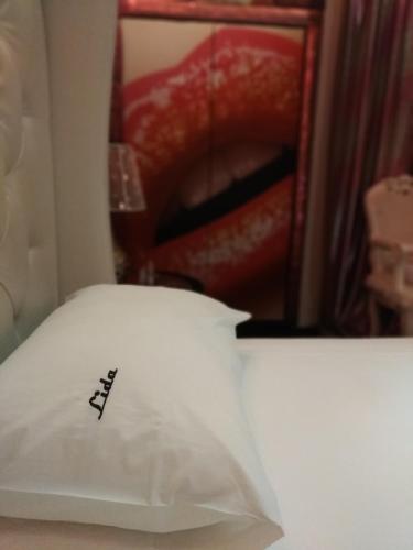 a pillow with the word avalon written on it at Lida Hotel in Athens